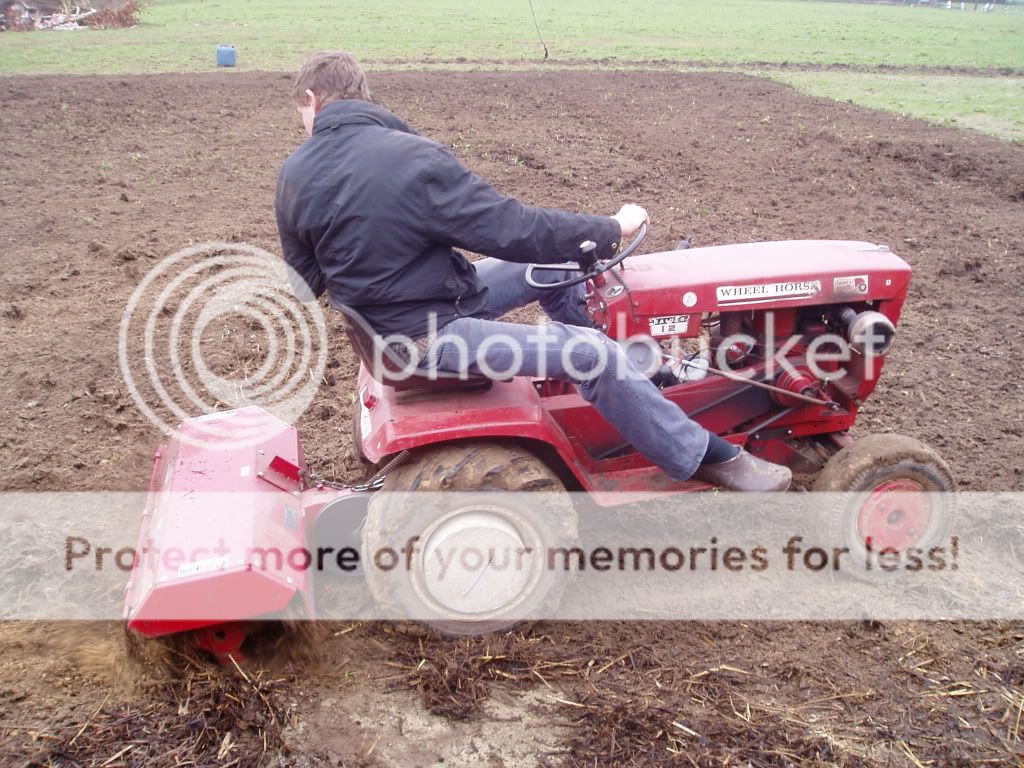 wheel horse raider 12 tilling the garden Wheel Horse Tractors
