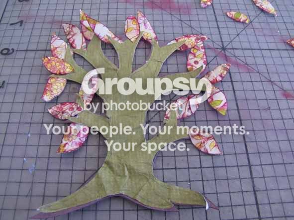 Stick the tree and the leaves to the cardstock