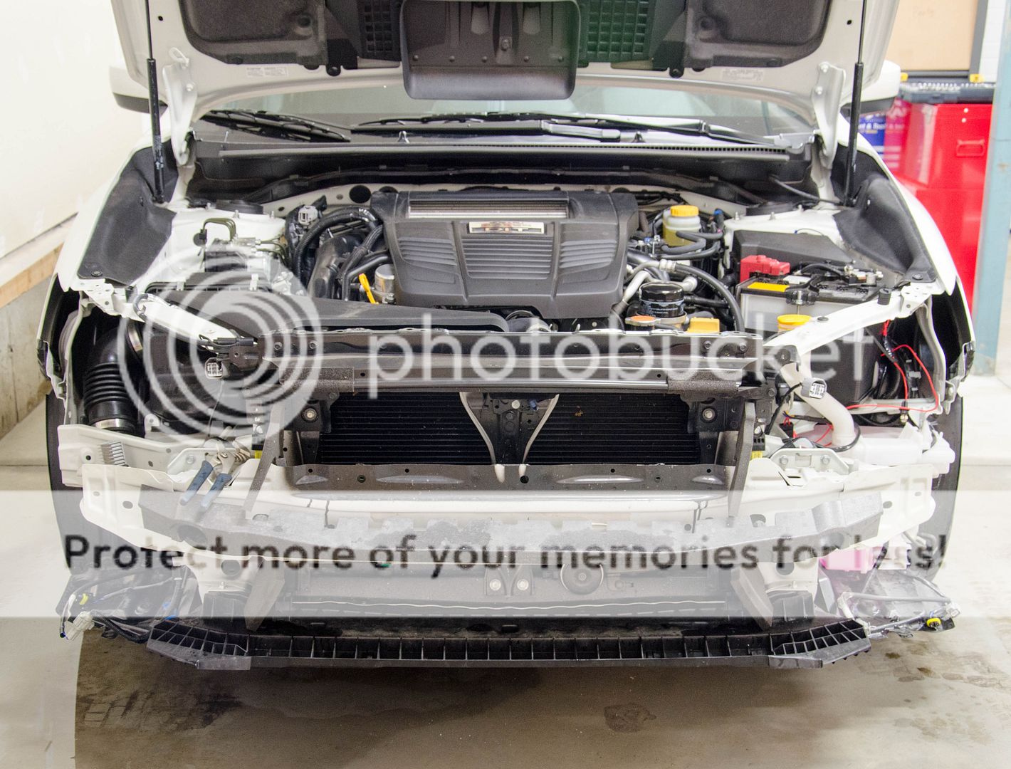The headlight should just pop on off now. Just disconnect the grey harness connector and set the headlights aside.